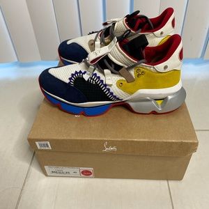 CHRISTIAN LOUBOUTIN
Red Runner Suede Mesh Trainers